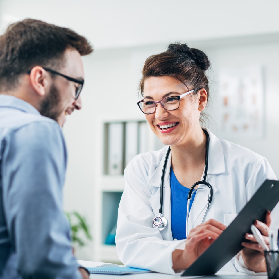 Doctor and patient sitting in doctor's office