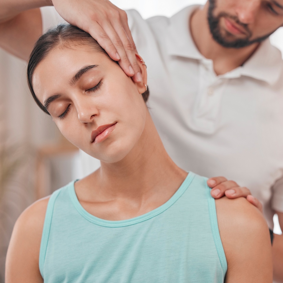 Physiotherapy, neck pain and stretching with woman and doctor for healthcare, chiropractic or consulting. Massage, wellness or medical with man and patient exam for rehabilitation, healing or therapy