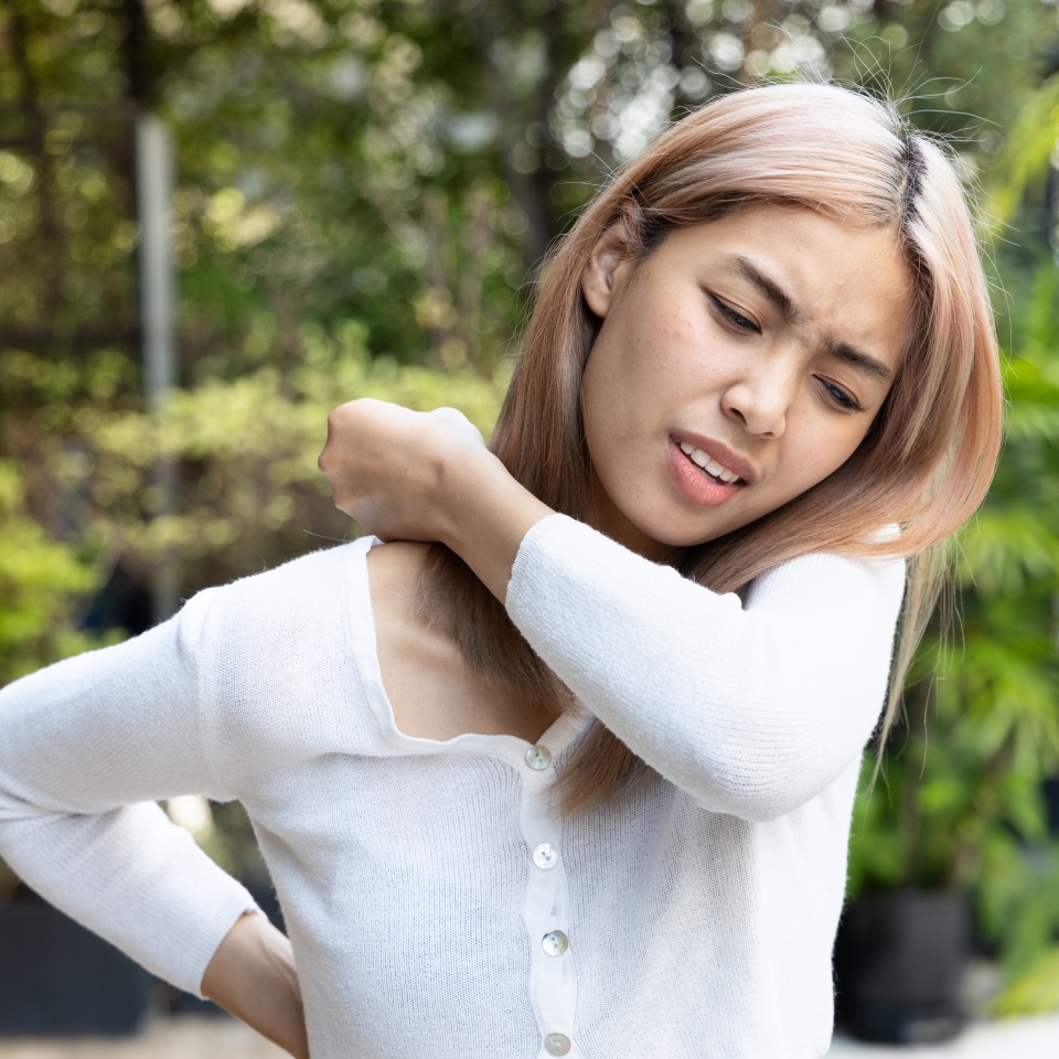 Painful and Unhappy Asian Woman Suffering from Office Syndrome, Dealing with Shoulder Pain