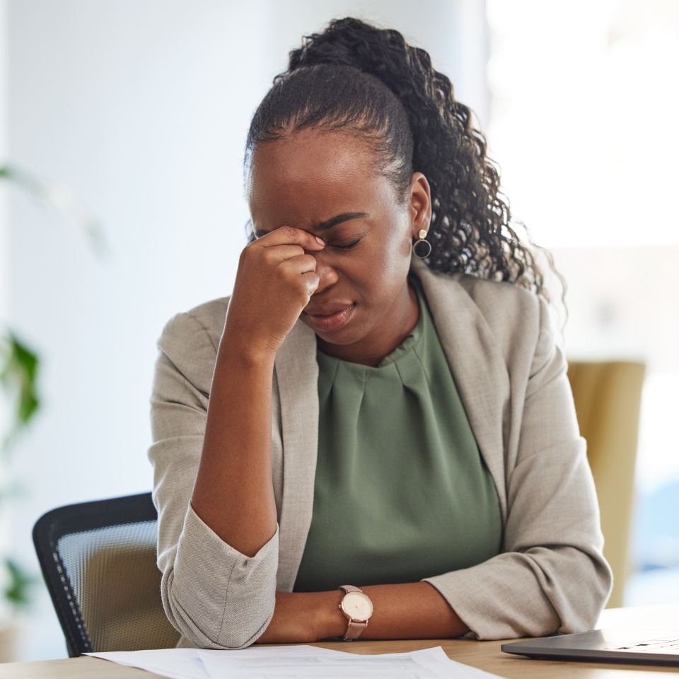 Crisis, stress and black woman with problem in office, sick or headache from brain fog. Frustrated, fatigue and African professional with business fail, mistake emoji or debt, bankruptcy or tax audit