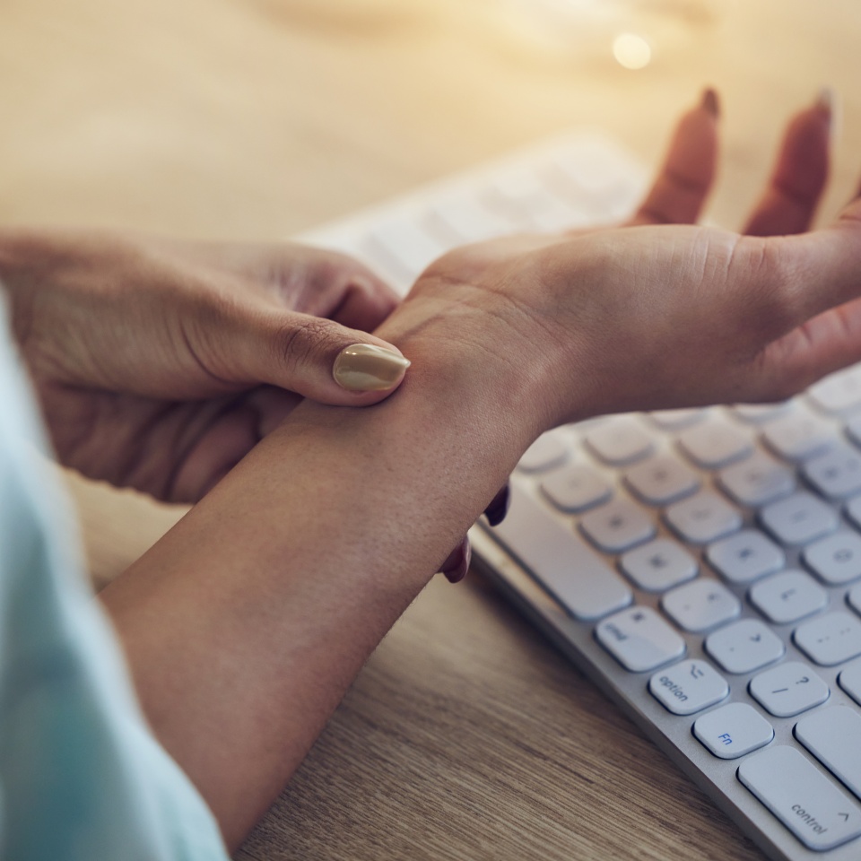 Wrist problem, computer keyboard or woman hands with carpal tunnel syndrome, osteoarthritis or joint pain. Closeup, copywriting typing fatigue and person with arthritis risk, fibromyalgia or injury