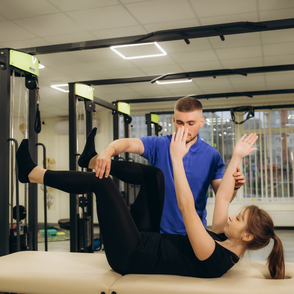 Physiotherapist working with patient in rehabilitation center. High quality photo