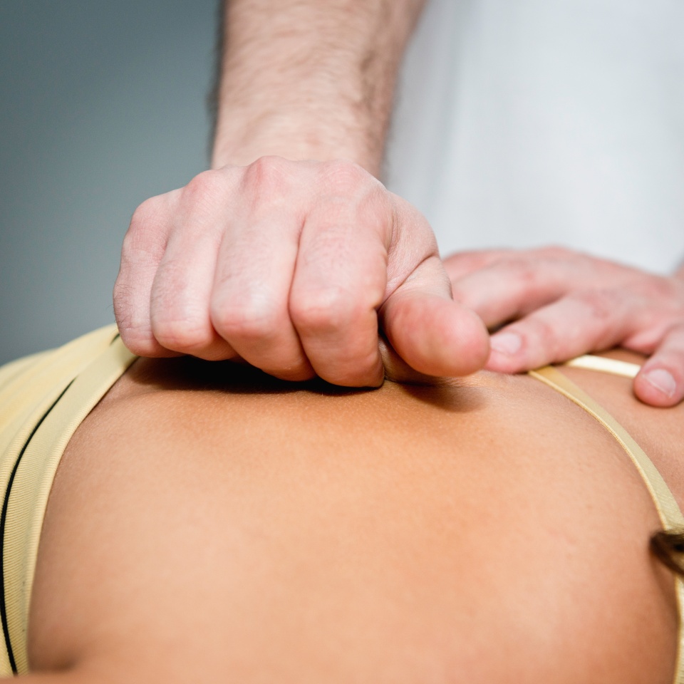 Myofascial Release - practitioner working on patient's back